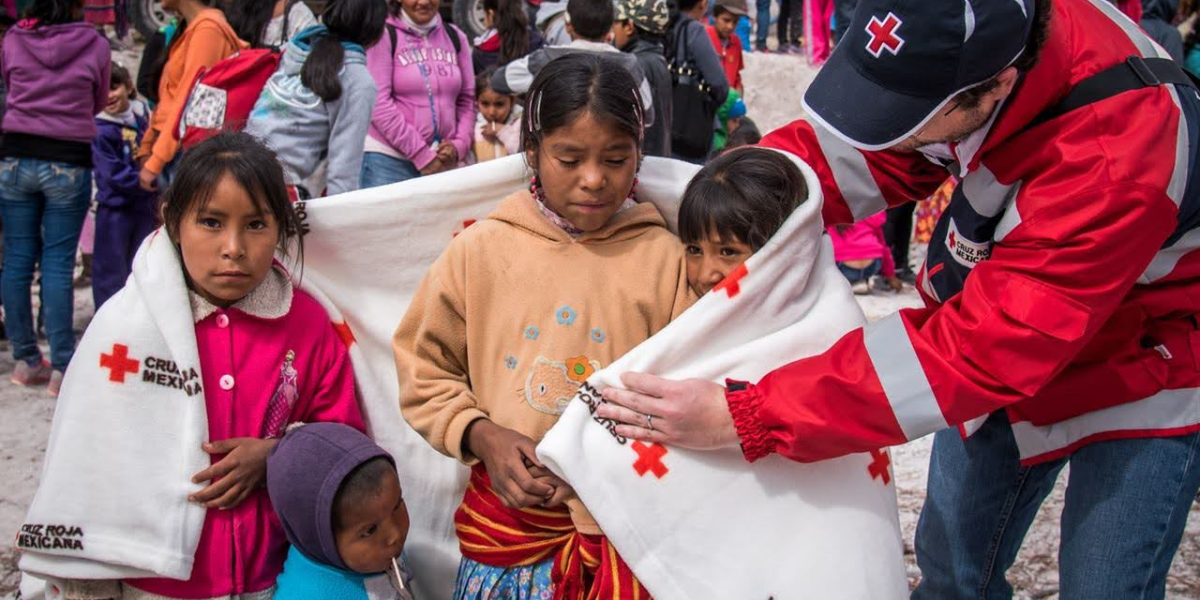 Cruz Roja Mexicana team member with four children - Simply Saving Lives