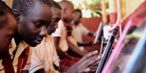 Children in Uganda interact with a touch screen in a “Hello Hub.”